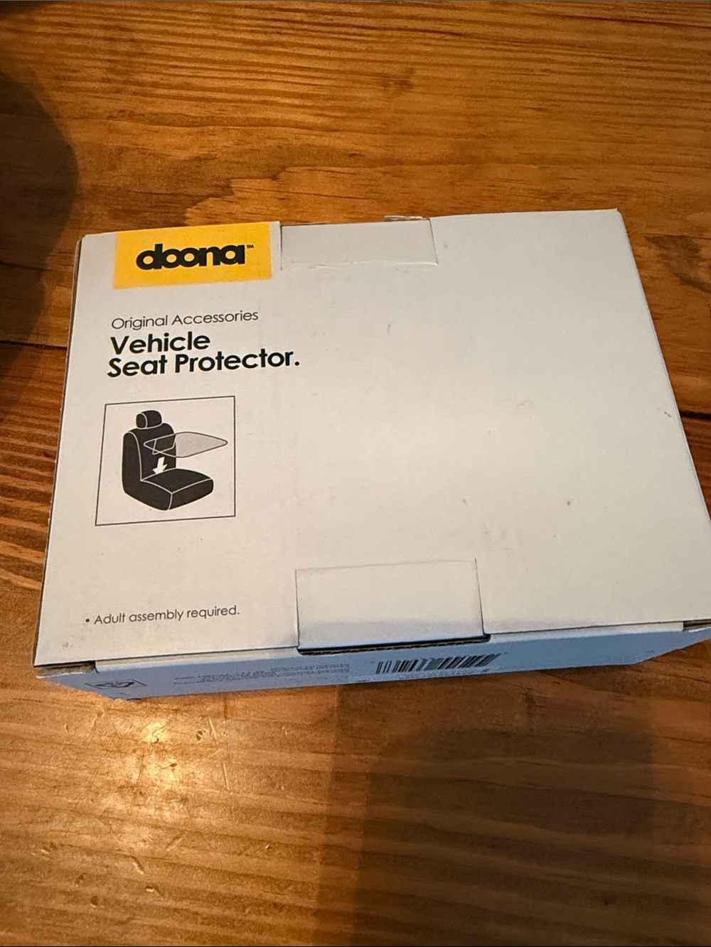 Doona Vehicle Seat Protector — White Box with Yellow Logo